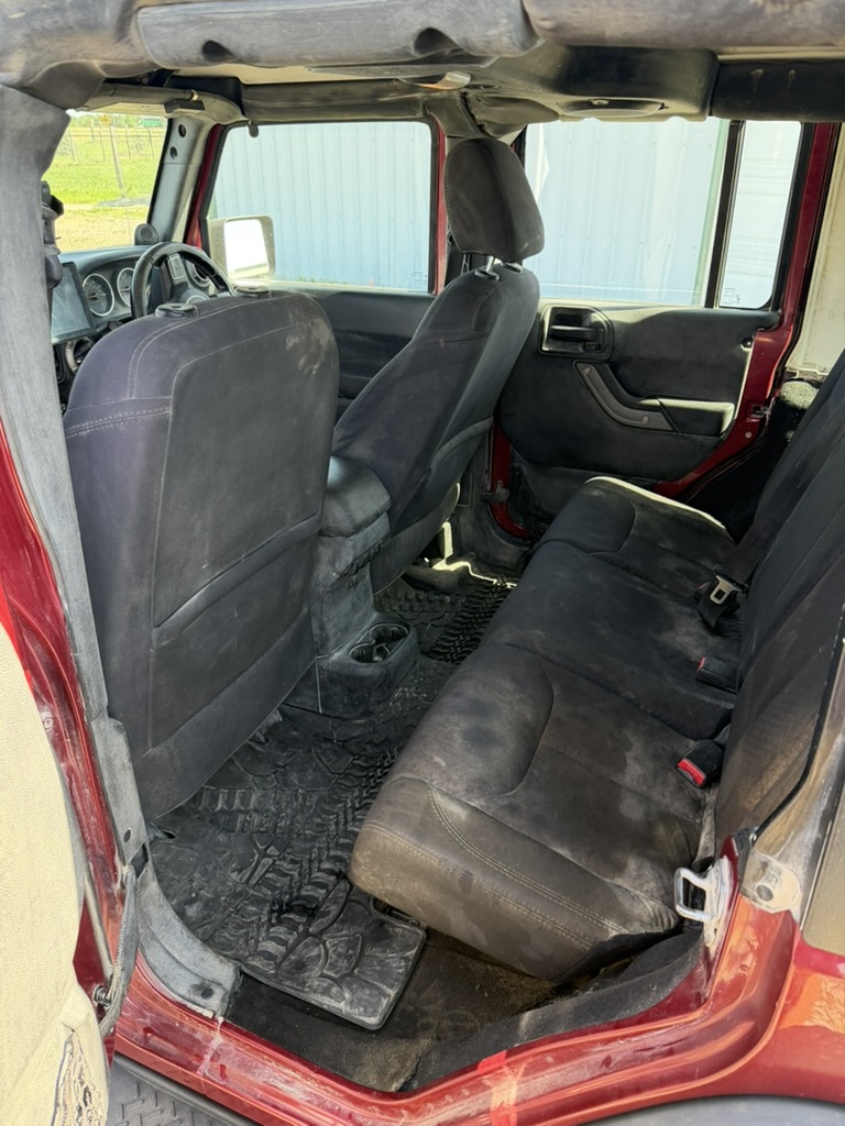 Before: Jeep Wrangler interior, mobile detailed by Blue Badge Customs in Lawrence, Kansas