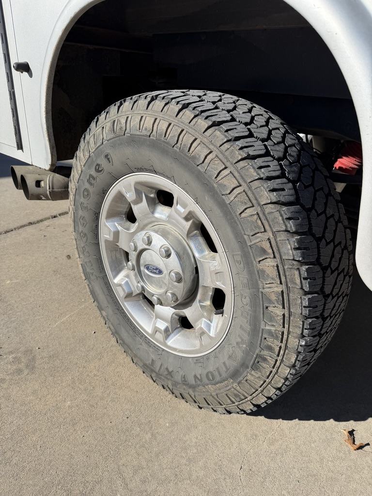 Before: Ford F-350 wheel, mobile detailed by Blue Badge Customs in Lawrence, Kansas