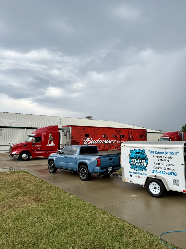 Blue Badge Customs mobile detailing truck and trailer on a job in Lawrence, Kansas