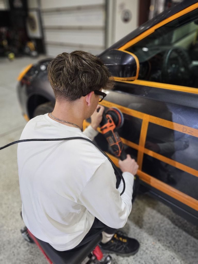Polishing a paint correction test section at Detailing Success training, Blue Badge Customs mobile detailing in Lawrence, Kansas
