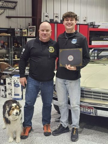 Receiving the course certificate at Detailing Success training, Blue Badge Customs mobile detailing in Lawrence, Kansas
